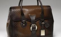古馳-1921 collection- 泥黃色真皮手提旅行包，配鑰匙扣和帶“G.Gucci Firenze 1921”草體字金屬牌的標識牌