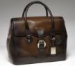 古馳-1921 collection- 泥黃色真皮手提旅行包，配鑰匙扣和帶“G.Gucci Firenze 1921”草體字金屬牌的標識牌