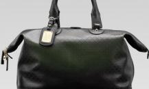 古馳-1921 collection- 深綠色真皮手提旅行包，配鑰匙扣和帶“G.Gucci Firenze 1921”草體字金屬牌的標識牌